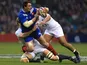 France's Louis Picamoles is tackled by two England players during the RBS Six Nations match on February 23, 2013