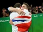 Gymnast Max Whitlock celebrates with coach Scott Hann at the Rio Olympics on August 14, 2016
