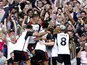 Fulham's Bobby Decordova-Reid celebrates scoring their first goal with teammates on August 12, 2023