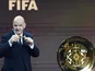Gianni Infantino poses with the Club World Cup trophy (TCE)