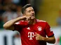 Robert Lewandowski celebrates scoring the third during the German Super Cup game between Eintracht Frankfurt and Bayern Munich on August 12, 2018
