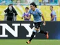 Uruguay's Edinson Cavani celebrates after scoring his second goal against Italy during the Confederations Cup on June 30, 2013