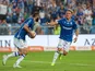 Lech Poznan players celebrate after scoring against Cracovia, on July 18, 2025