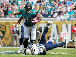Marcedes Lewis #89 of the Jacksonville Jaguars runs for yardage during the game against the San Diego Chargers at EverBank Field on October 20, 2013