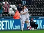 Swansea City's Bersant Celina and Daniel James celebrate after Brentford's Luke Daniels scores an own goal on February 17, 2019