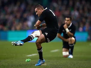Aaron Cruden of the All Blacks kicks the match winning kick during the International match between Ireland and the New Zealand All Blacks at Aviva Stadium on November 24, 2013