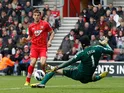 Jay Rodriguez slots the ball past Petr Cech to score the opening goal against Chelsea on March 30, 2013