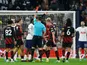 Tottenham Hotspur's Cristian Romero is shown a red card by referee Andrew Madley after receiving two yellow cards on February 5, 2023