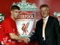 Liverpool's Steven Gerrard shakes hands with Rick Parry after deciding to stay at the club in 2004
