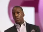 Retired US sprinter Michael Johnson speaks on the second day of the Doha Goals summit in the Qatari capital on December 11, 2013