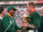 South Africa captain Francois Pienaar is given the William Webb Ellis Cup by president Nelson Mandela after winning the 1995 World Cup final
