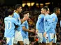Manchester City's Rodri celebrates scoring their first goal with teammates on April 3, 2024