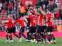 Southampton players celebrate their survival after drawing with Bournemouth on April 27, 2019