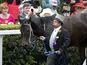 Black Caviar is led round the parade ring after winning the Diamond Jubilee Stakes on the fifth day of Royal Ascot horse race meeting on July 23, 2012