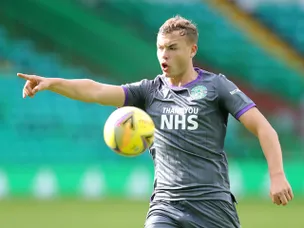 Ryan Porteous heads home as Hibernian beat 10-man St Mirren