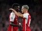 Arsenal's Leandro Trossard celebrates scoring their second goal with teammate Bukayo Saka on September 20, 2023
