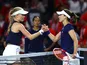 Harriet Dart and Alize Cornet pictured shake hands at the net on April 14, 2023