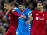 Liverpool's Joel Matip and Virgil van Dijk in action with Atletico Madrid's Luis Suarez on November 3, 2021