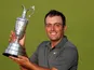 Italy's Francesco Molinari celebrates with the Claret Jug after winning the 147th Open Championship on July 22, 2018 