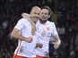 Netherlands' midfielder Arjen Robben (L) celebrates with Netherlands' midfielder Daley Blind (R) after scoring Netherlands' second goal during the international friendly football match between Wales and Netherlands at Cardiff City Stadium in south Wales o