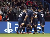 Paris Saint-Germain's (PSG) Lionel Messi celebrates scoring their second goal with teammates on September 28, 2021
