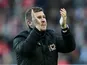 MK Dons manager Karl Robinson claps after the FA Cup match against AFC Wimbledon on December 2, 2012