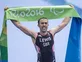 Lewis wins historic triathlon gold