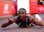Sisay Lemma celebrates winning the men's London Marathon on October 3, 2021
