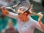 Victoria Azarenka returns the ball to Elena Vesnina during their first round match of the French Open on May 29, 2013