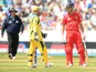 England's Jonathan Trott and Australia's Matthew Wade during the ICC Champions Trophy match on June 8, 2013