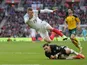 Jamie Vardy makes a flying leap over Ernestas Setkus during the World Cup qualifier between England and Lithuania on March 26, 2017