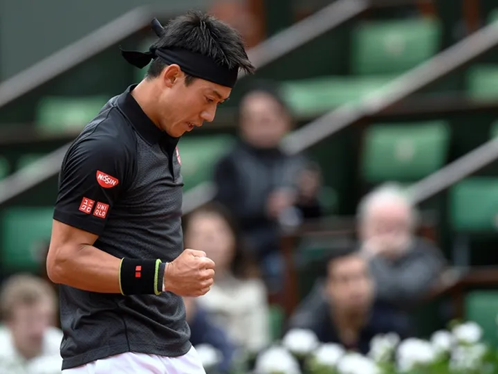 Nishikori wins rain-affected opener