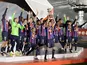 Barcelona's Sergio Busquets lifts the trophy as he celebrates with teammates after winning the Spanish Super Cup on January 15, 2023
