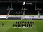Fulham and Wolverhampton Wanderers players observe a period of silence following Prince Philip's death on April 9, 2021
