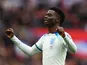 Bukayo Saka celebrates scoring for England on March 26, 2023