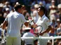 Cameron Norrie and Kei Nishikori shake hands after their clash at Wimbledon on July 4, 2019