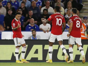 Manchester United's Jadon Sancho celebrates scoring their first goal with Marcus Rashford and Bruno Fernandes on September 1, 2022