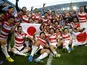 Japan players celebrate beating South Africa at the 2015 Rugby World Cup