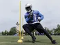 Lions' RB Reggie Bush runs a practice drill on May 30, 2013