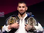 Ilia Topuria pictured with his UFC belts.