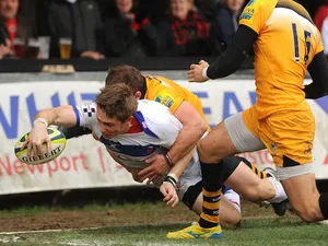 Matthew Pewtner of Newport Gwent Dragons scores a try during the LV= Cup match between Newport Gwent Dragons and London Wasps at Rodney Parade on November 16, 2013