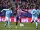 Juanfran penalty sends Atletico through