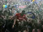 Cardiff City's Leon Barnett is carried by fans after winning promotion to the Premier League on April 16, 2013