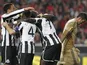 Newcastle players congratulate Papiss Cisse after his goal against Benfica on April 4, 2013