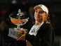Elena Rybakina poses with the trophy after winning the Italian Open on May 20, 2023