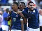 France's Kylian Mbappe celebrates with Rayan Cherki and Jules Kounde on June 16, 2026