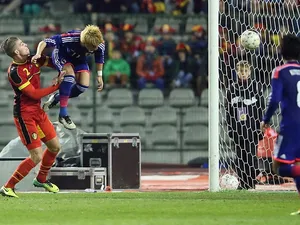 Japan's Yoichiro Kakitani heads in his team's opening goal against Belgium during their international friendly match on November 19, 2013