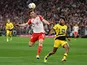 Bayern Munich's Joshua Kimmich in action with Borussia Dortmund's Ian Maatsen on March 30, 2024