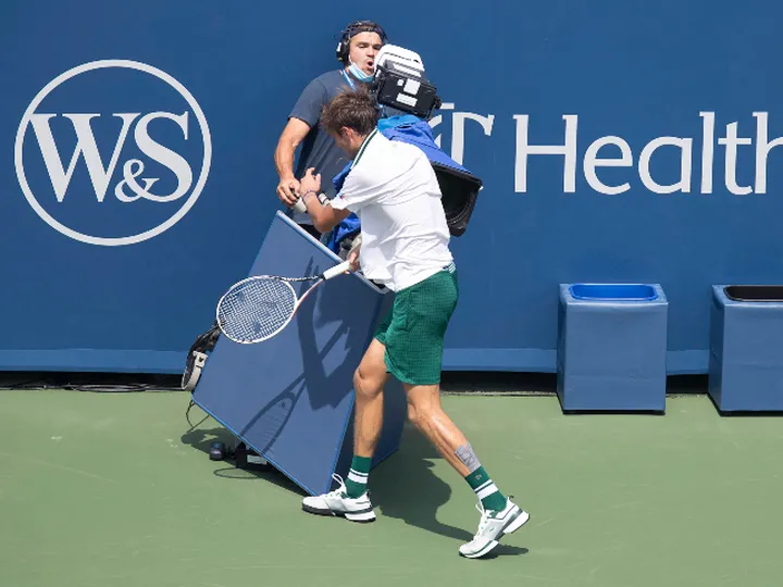 Daniil Medvedev collides with TV camera during semi-final defeat