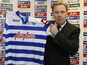 Harry Redknapp holds his QPR shirt proudly on November 26, 2012